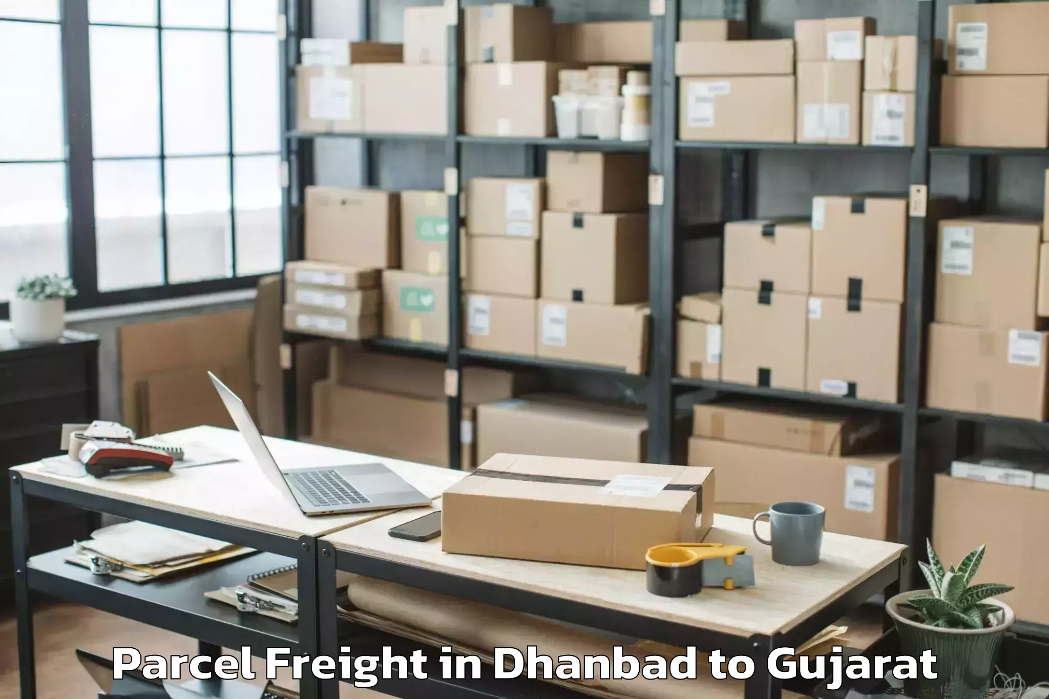 Easy Dhanbad to Modasa Parcel Freight Booking